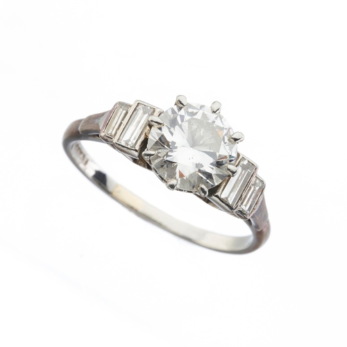 161 - An Art Deco platinum circular-cut diamond single-stone ring, with graduated rectangular-shape diamon... 