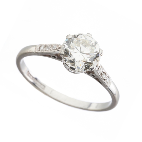 165 - An Art Deco platinum transitional-cut diamond single-stone ring, with diamond shoulders, principal d... 