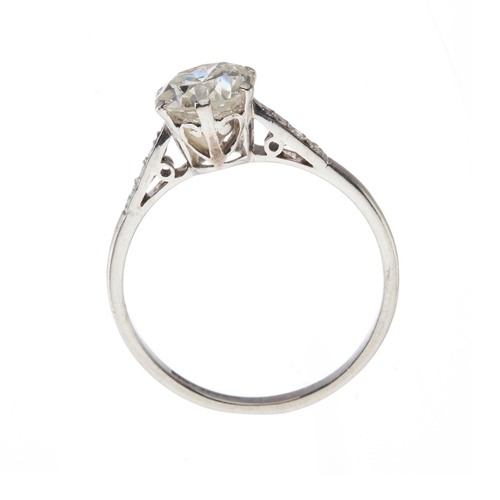 165 - An Art Deco platinum transitional-cut diamond single-stone ring, with diamond shoulders, principal d... 