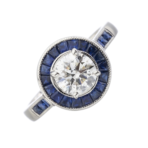 168 - An 18ct gold brilliant-cut diamond single-stone dress ring, with calibre-cut sapphire surround, tota... 