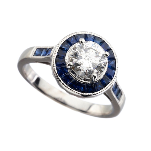 168 - An 18ct gold brilliant-cut diamond single-stone dress ring, with calibre-cut sapphire surround, tota... 