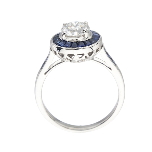 168 - An 18ct gold brilliant-cut diamond single-stone dress ring, with calibre-cut sapphire surround, tota... 