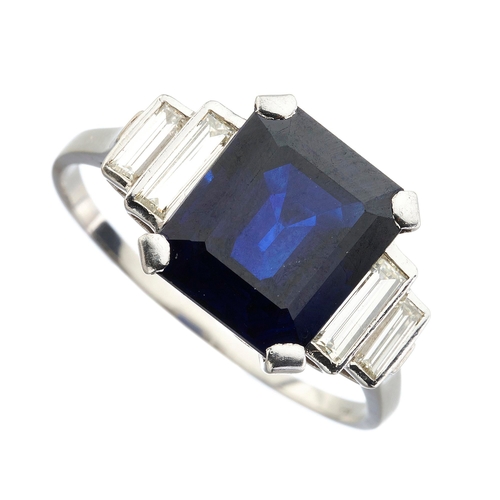 170 - A sapphire single-stone dress ring, with rectangular-shape diamond stepped sides, sapphire estimated... 