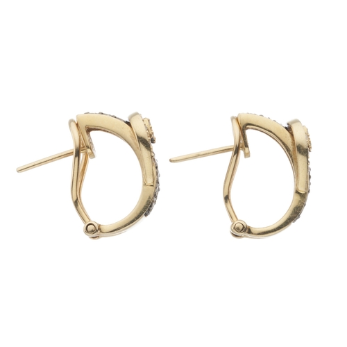 181 - A pair of 14ct gold diamond hoop earrings, each designed as a buckle belt, estimated total diamond w... 