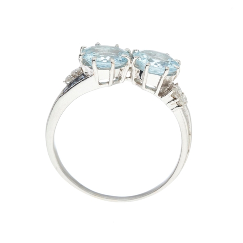 182 - An 18ct gold aquamarine two-stone dress ring, with brilliant-cut diamond and calibre-cut tanzanite s... 