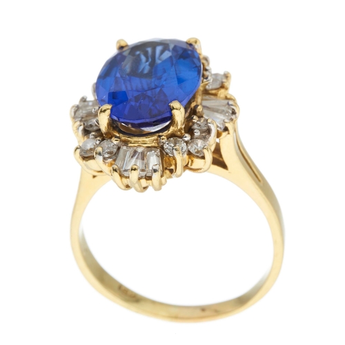 192 - An 18ct gold tanzanite and diamond cluster ring, tanzanite estimated weight 6ct, estimated total dia... 