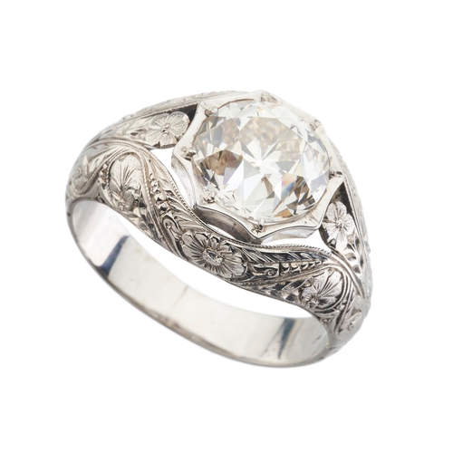 194 - An old-cut diamond single-stone band ring, with floral engraved surround and shoulders, diamond esti... 