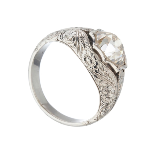 194 - An old-cut diamond single-stone band ring, with floral engraved surround and shoulders, diamond esti... 