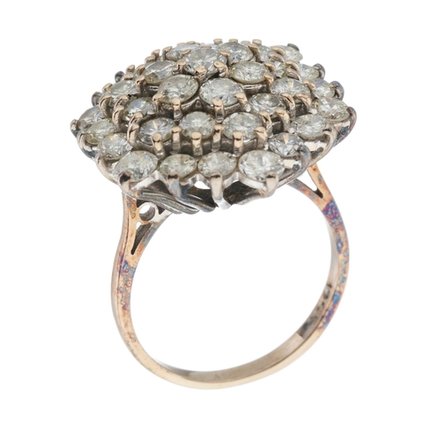 202 - An 18ct gold brilliant-cut diamond stepped cluster dress ring, estimated total diamond weight 3.25ct... 