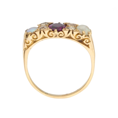 204 - An early 20th century 18ct gold garnet and split pearl dress ring, with old-cut diamond double space... 