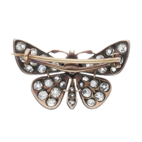 21 - A late Victorian old-cut diamond butterfly brooch, with pink sapphire cabochon eyes, estimated total... 