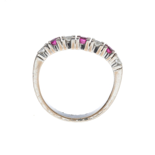 215 - An 18ct gold ruby and brilliant-cut diamond half eternity ring, estimated total diamond weight 0.25c... 