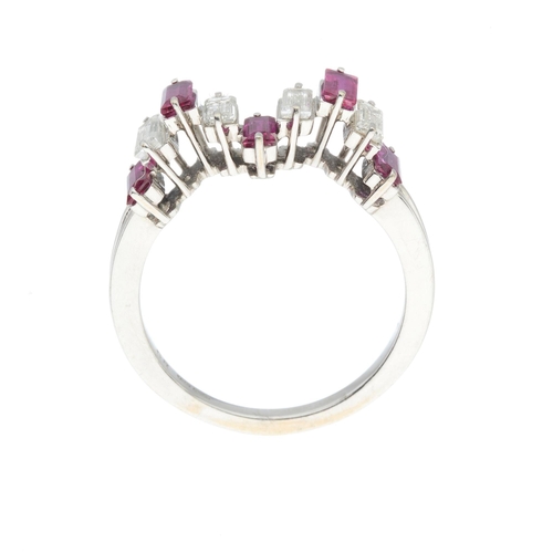 218 - An 18ct gold ruby and diamond dress ring, of stepped design, estimated total diamond weight 0.40ct, ... 