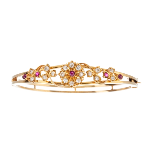 22 - A late Victorian gold ruby and old-cut diamond floral bangle bracelet, estimated total diamond weigh... 