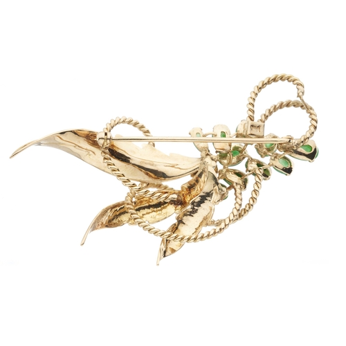 28 - A 14ct gold jadeite floral spray brooch, stamped 14k, length 6.6cm, 11.6g