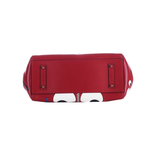 283 - Anya Hindmarch, an Ebury All Over Sticker handbag, crafted from red leather featuring colourful fun ... 