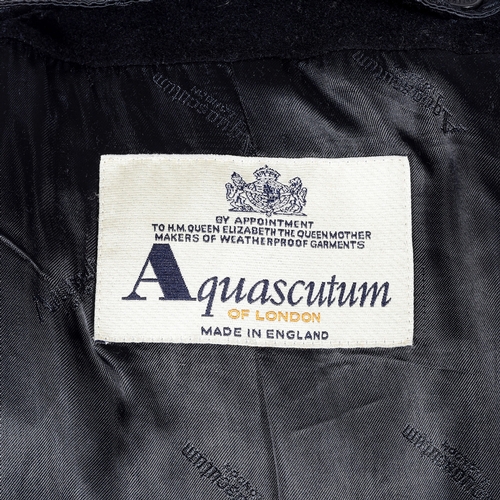 286 - Aquascutum, a ladies black coat with faux fur trim, designed with a detachable faux fox collar, doub... 