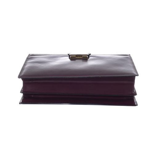 291 - Bally, a Bordeaux leather briefcase, crafted from smooth burgundy leather, with brushed gold-tone ha... 