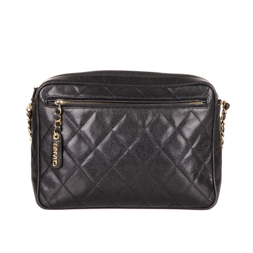 317 - Chanel, a vintage large caviar camera bag, designed with a diamond quilted black caviar leather exte... 