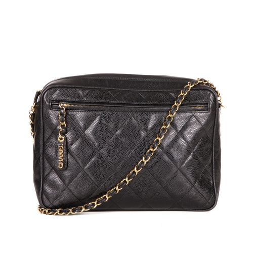 317 - Chanel, a vintage large caviar camera bag, designed with a diamond quilted black caviar leather exte... 