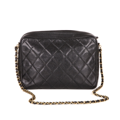 317 - Chanel, a vintage large caviar camera bag, designed with a diamond quilted black caviar leather exte... 