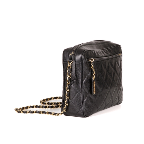 317 - Chanel, a vintage large caviar camera bag, designed with a diamond quilted black caviar leather exte... 