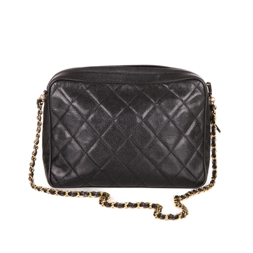 317 - Chanel, a vintage large caviar camera bag, designed with a diamond quilted black caviar leather exte... 