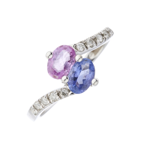 32 - A 14ct gold pink and blue sapphire crossover ring, with brilliant-cut diamond line shoulders, estima... 