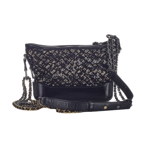 321 - Chanel, a small Gabrielle hobo handbag, designed with a black and white tweed and sequin embellished... 