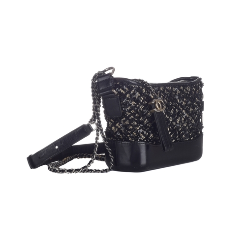 321 - Chanel, a small Gabrielle hobo handbag, designed with a black and white tweed and sequin embellished... 