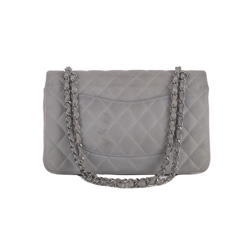 324 - Chanel, a medium Classic Double Flap handbag, designed with a diamond quilted caviar leather exterio... 