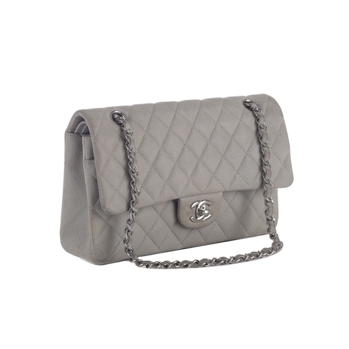 324 - Chanel, a medium Classic Double Flap handbag, designed with a diamond quilted caviar leather exterio... 