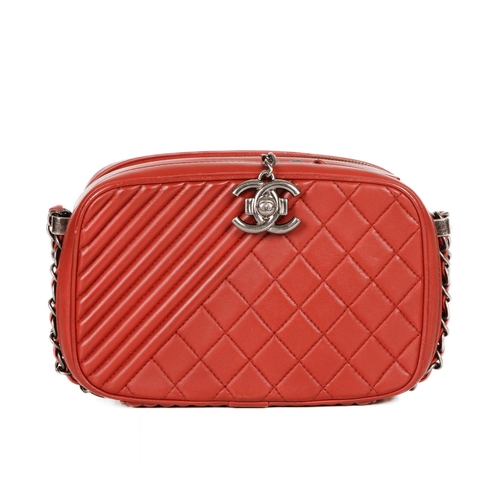 326 - Chanel, a Coco Boy camera bag, featuring a red quilted leather exterior, with antiqued silver-tone h... 