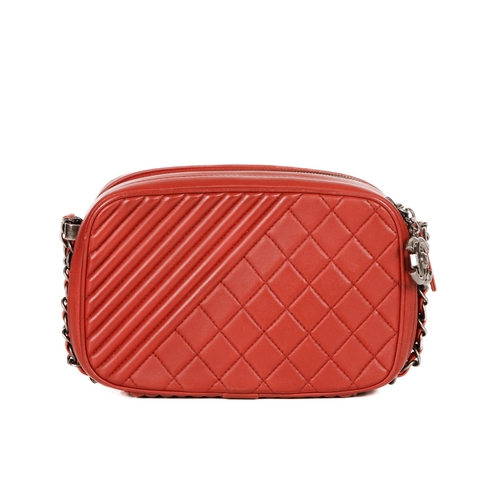 326 - Chanel, a Coco Boy camera bag, featuring a red quilted leather exterior, with antiqued silver-tone h... 