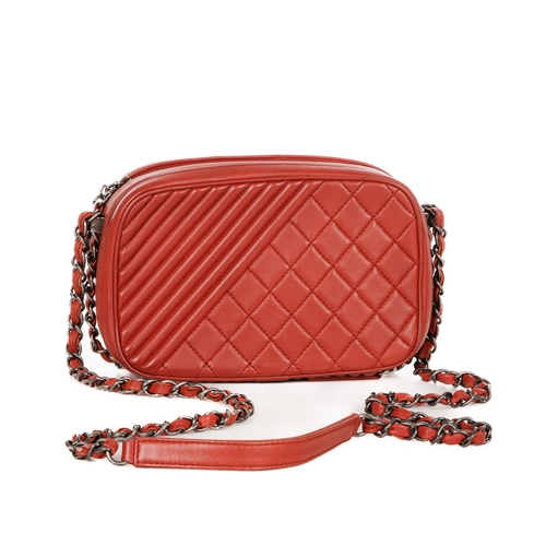 326 - Chanel, a Coco Boy camera bag, featuring a red quilted leather exterior, with antiqued silver-tone h... 