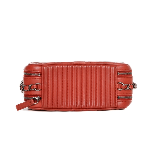 326 - Chanel, a Coco Boy camera bag, featuring a red quilted leather exterior, with antiqued silver-tone h... 