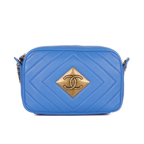 327 - Chanel, a Pyramid camera bag, featuring a blue diamond-quilted leather exterior, with aged gold-tone... 