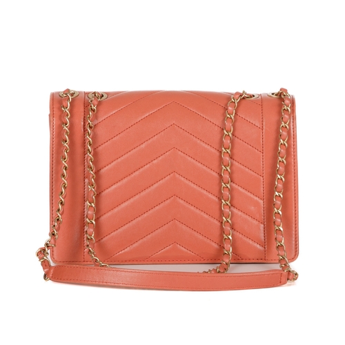 328 - Chanel, a Reversed Chevron Envelope Flap handbag, crafted from peach lambskin leather, with brushed ... 