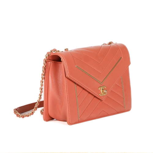 328 - Chanel, a Reversed Chevron Envelope Flap handbag, crafted from peach lambskin leather, with brushed ... 