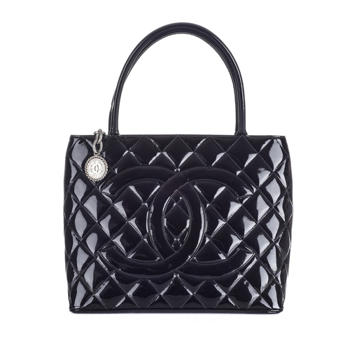 332 - Chanel, a Timeless Medallion tote, crafted from black patent leather with the maker's classic diamon... 