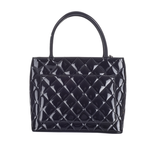 332 - Chanel, a Timeless Medallion tote, crafted from black patent leather with the maker's classic diamon... 