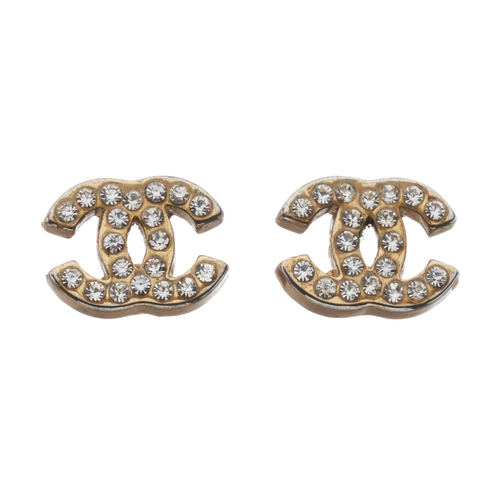 334 - Chanel, a pair of CC stud earrings, crafted from gold-tone hardware with crystal embellishments and ... 