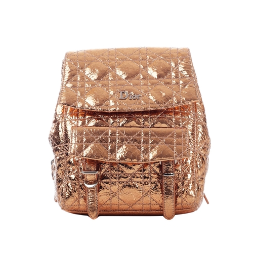 337 - Christian Dior, a small Cannage Stardust backpack, featuring a metallic rose-gold crinkled calfskin ... 