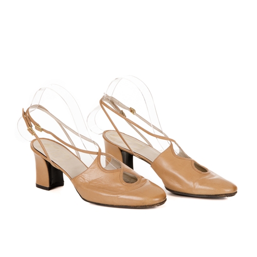 347 - Christian Dior, a pair of vintage shoes, designed with beige leather uppers, cut-out detailing at th... 