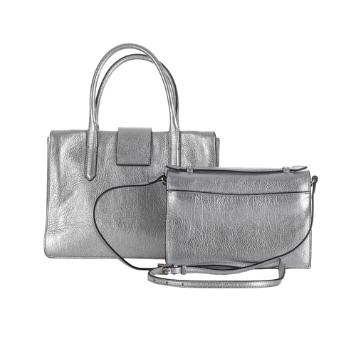 356 - Coccinelle, two silver leather crossbody handbags, both of a similar design with silver-tone hardwar... 