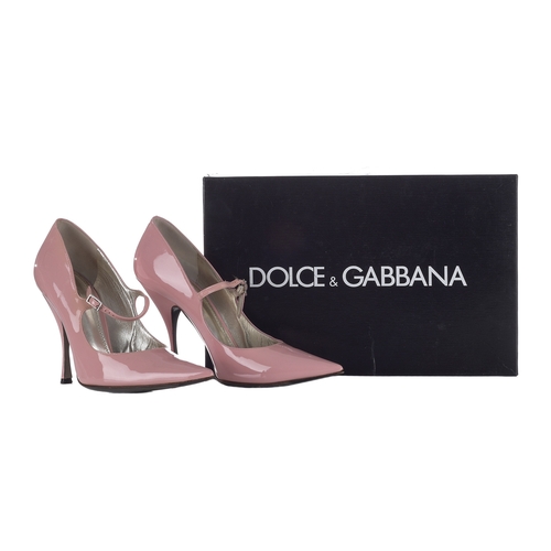 360 - Dolce & Gabbana, a pair of pink patent leather heels, featuring a pointed toe, tapered stiletto heel... 