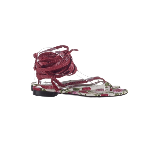 361 - Dolce & Gabbana, a pair of unworn ankle wrap thong sandals, crafted from pink lizard leather and flo... 