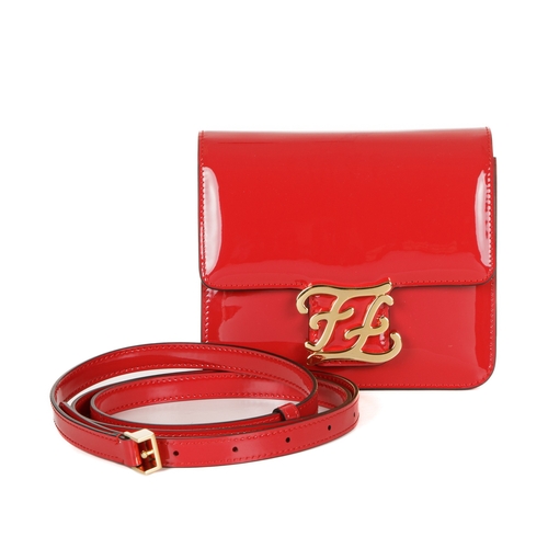 365 - Fendi, a Karligraphy patent leather handbag, designed with a cardinal red patent leather exterior, w... 