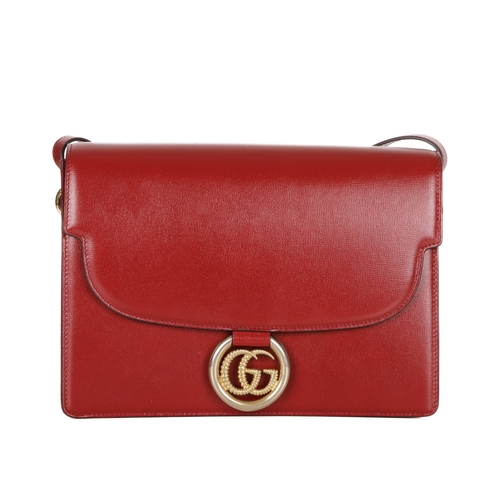 372 - Gucci, a red leather satchel, featuring an adjustable leather shoulder strap, magnetic flap closure ... 