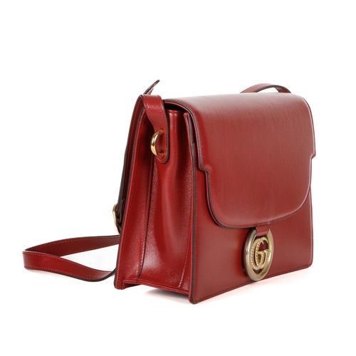 372 - Gucci, a red leather satchel, featuring an adjustable leather shoulder strap, magnetic flap closure ... 